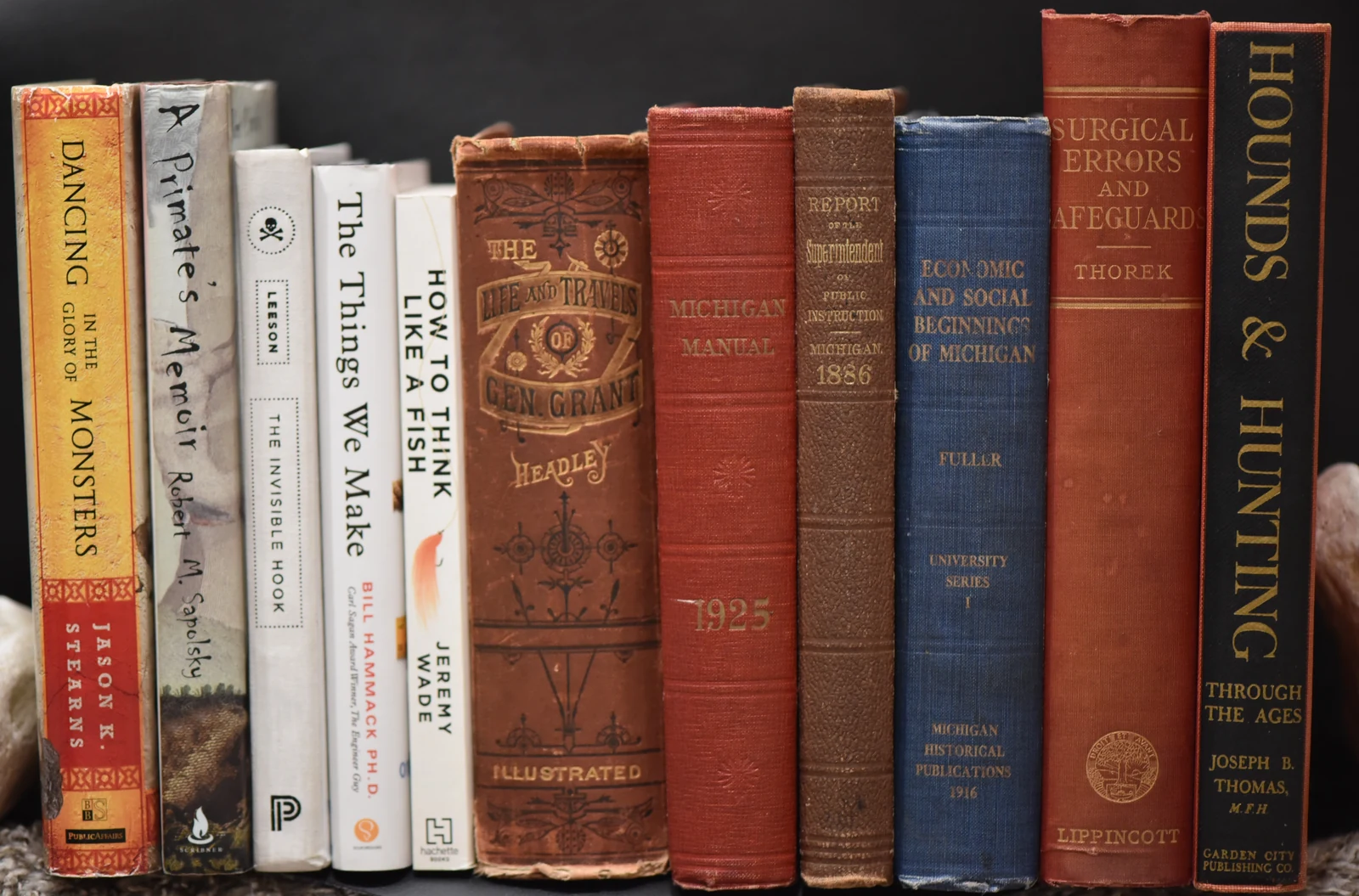 A row of books from my collection, including older Michigan history and scientific volumes.