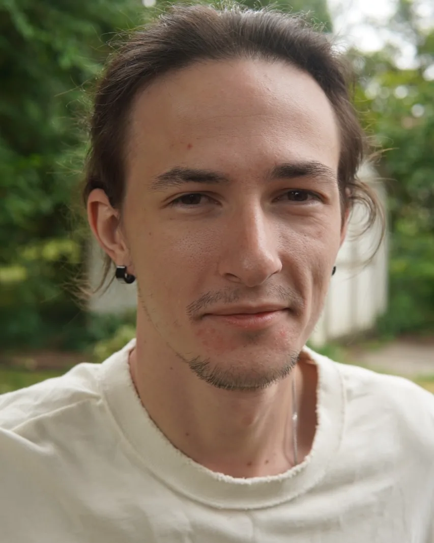 Portrait of Grant Cooper outdoors.