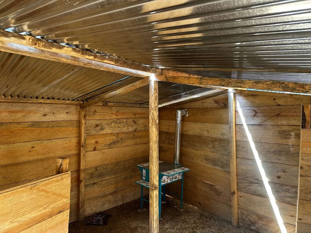 Interior of a wooden house built during volunteer work in Guatemala.