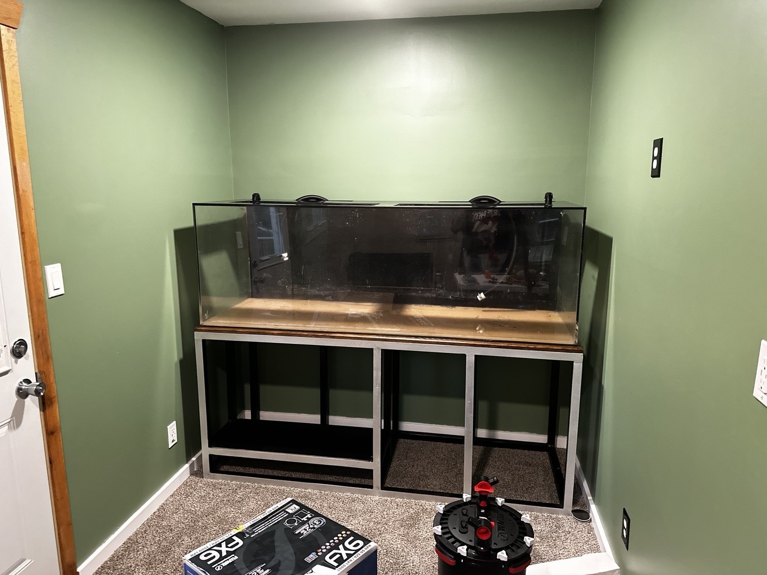 Restored 180-gallon acrylic aquarium installed on the completed aluminum stand