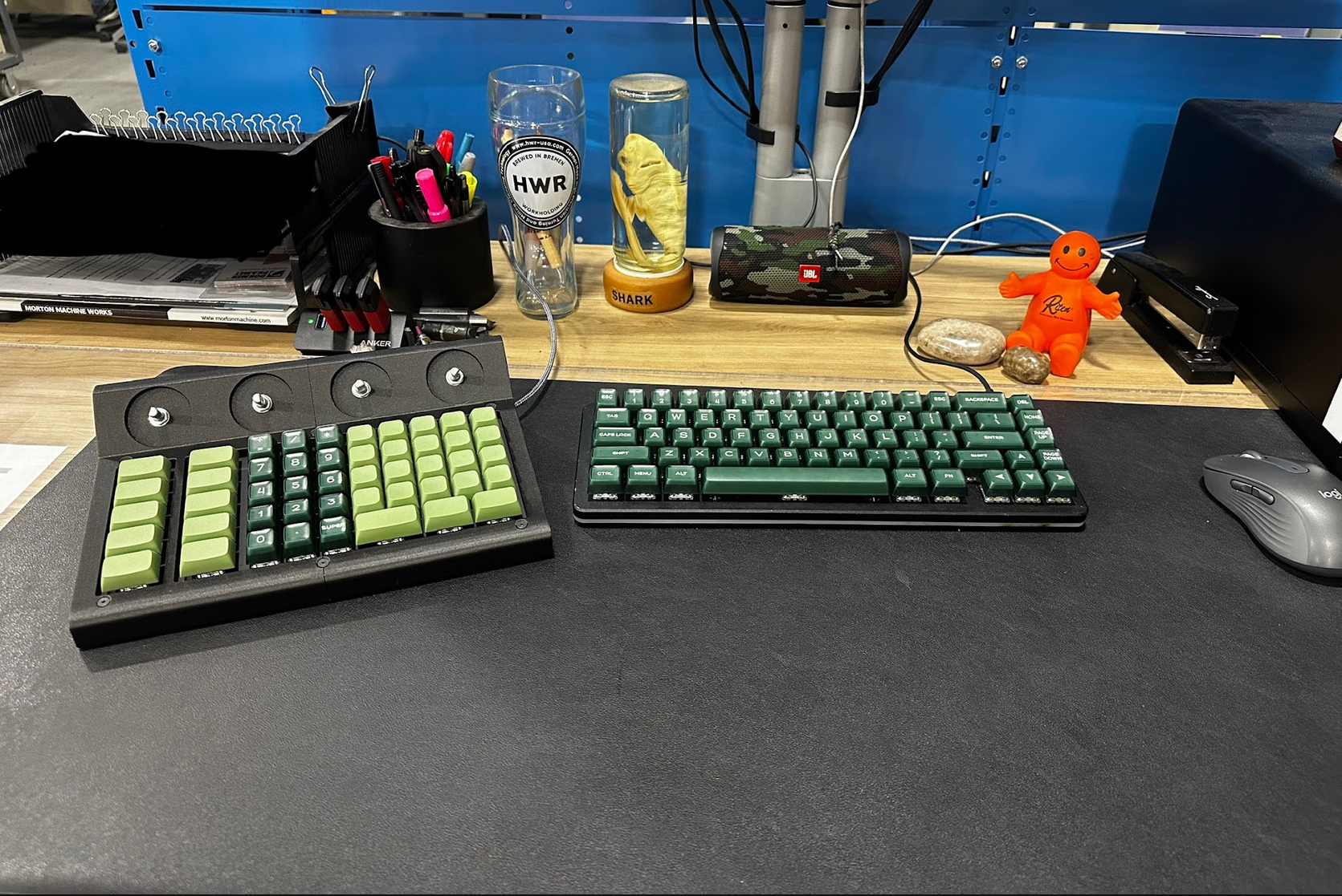 CAMpad with green keys on a desk beside a keyboard and mouse